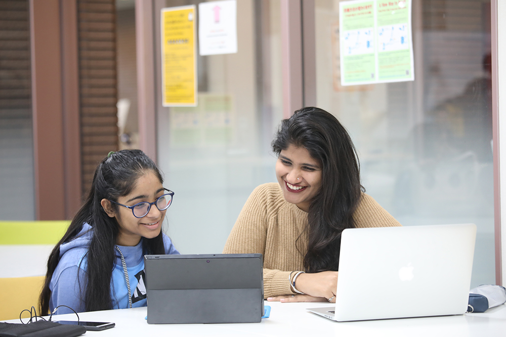 APU students at laptop